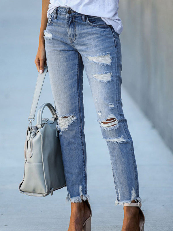 Denim trousers with rips